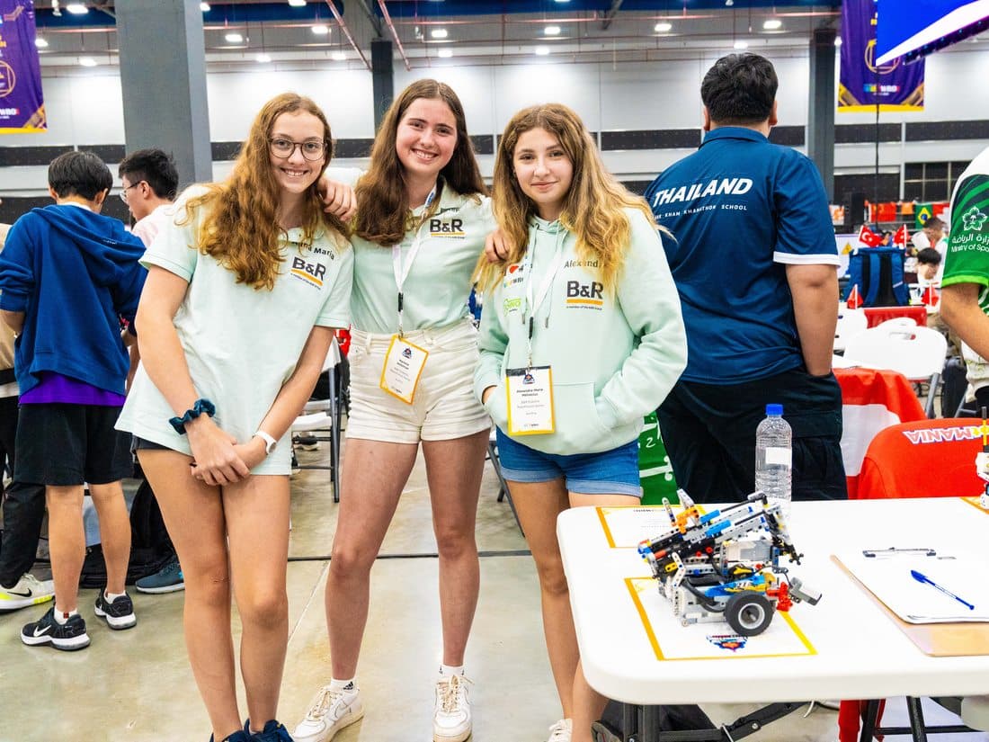 Students celebrating with their robot at the World Robot Olympiad