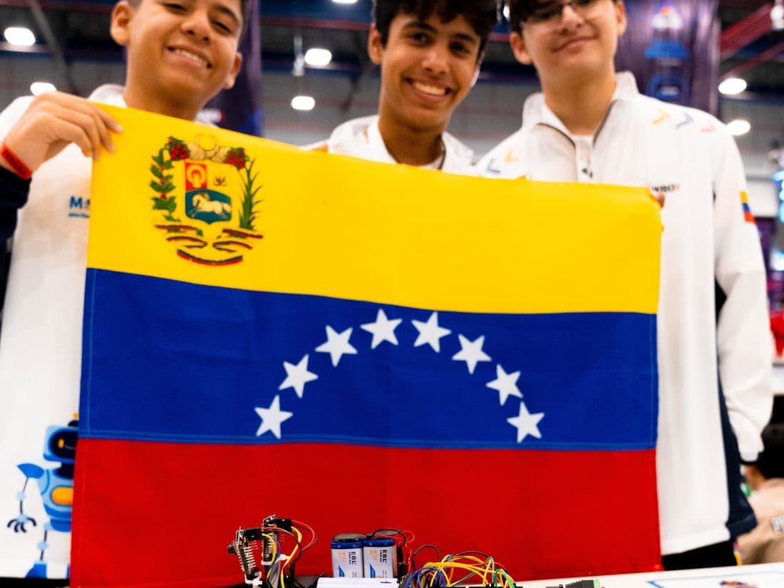 Venezuela delegation with their robot and flag